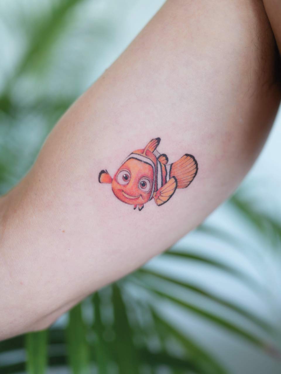 tatouage de Némo en couleur sur l'intérieur du bras